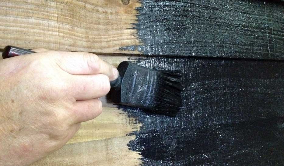 barn paint application by brush